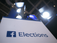 In this Aug. 6, 2015, file photo Facebook Elections signs stand in the media area in Cleveland before the first Republican presidential debate. The head of Trump-affiliated data-mining firm Cambridge Analytica was suspended on Tuesday, March 20, 2018, while government authorities are bearing down on both the firm and Facebook over allegations the firm stole data from 50 million Facebook users to manipulate elections. (AP Photo/John Minchillo, File)