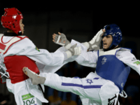 Ron Atias of Israel, and Venilton Teixeira of Brazil compete in the men's Taekwondo event at the 2016 Summer Olympics in Rio de Janeiro, Brazil, Wednesday, Aug. 17, 2016. (AP Photo/Andrew Medichini)