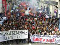 Demonstrators march during a protest against French President Emmanuel Macrons government reforms, in Marseille, France, Saturday, April 14, 2018. Banners read: “Indefinite general strike-Against the laws which oppress us, freedom and asylum”. (AP Photo/Claude Paris)