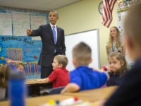 President Barack Obama takes questions from first grade students during a classroom visit at Gen. Clarence Tinker elementary school at MacDill Air Force Base, Fla., Wednesday, Sept. 17, 2014. Obama is returning to Washington after visiting US Central Command (CentCom) and was updated on the ongoing military campaigns in Iraq and Syria. Standing at the front with Obama is teacher Elizabeth Slagal. (AP Photo/Pablo Martinez Monsivais)
