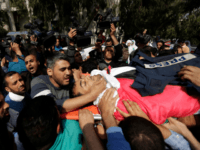 Mourners and journalists carry the body of Palestinian journalist Yasser Murtaja, during his funeral in Gaza City on April 7, 2018. Among those killed at Friday's protest was Yasser Murtaja, a photographer with the Gaza-based Ain Media agency, who died from his wounds after being shot, the local health ministry said. Murtaja's company confirmed his death, with witnesses saying he was close to the front of the protests in Southern Gaza when he was hit. / AFP PHOTO / MAHMUD HAMS (Photo credit should read MAHMUD HAMS/AFP/Getty Images)