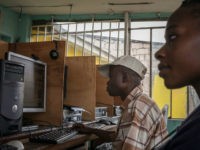 TO GO WITH AFP BY HABIBOU BANGRE Clients surf the internet at an internet cafe on February 25, 2015 in Kinshasa. Sales are down and business is slow -- small entrepreneurs in the Democratic Republic of Congo are bearing the brunt of an official clampdown on mobile Internet services and text messages. Internet operators remain powerless in the face of complaints from customers and have yet to communicate the extent of their losses caused by the restrictions. People, however, have found various ways of bypassing the restrictions although it has meant shelling out more. AFP PHOTO/FEDERICO SCOPPA (Photo credit should read FEDERICO SCOPPA/AFP/Getty Images)