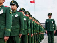 People's Liberation Army (PLA) soldiers participate in a ceremony at the Nanjing Massacre Memorial Hall on the second annual national day of remembrance to commemorate the 80th anniversary of the massacre in Nanjing on December 13, 2017. Sirens blared and thousands of doves were released as Chinese President Xi Jinping presided over a sombre ceremony in Nanjing marking 80 years since the wartime massacre in the city by Japanese troops. / AFP PHOTO / CHANDAN KHANNA (Photo credit should read CHANDAN KHANNA/AFP/Getty Images)