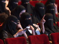 Saudi women attend the 'Short Film Competition 2' festival on October 20, 2017, at King Fahad Culture Center in Riyadh. The rare movie night this week in Riyadh was a precursor to what is expected to be a formal lifting of the kingdom's ban on cinemas, long vilified as vulgar and sinful by religious hardliners. / AFP PHOTO / FAYEZ NURELDINE (Photo credit should read FAYEZ NURELDINE/AFP/Getty Images)