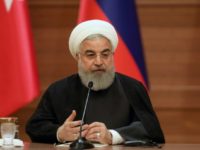 Iranian President Hassan Rouhani speaks during a joint press conference with the leaders of Turkey and Russia in Ankara on April 4, 2018