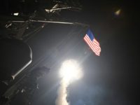 A cruise missile blasts off from the USS Porter during last year's strike on a Syrian air base in retaliation for a chemical attack
