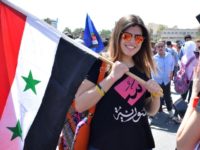 Syrians rally in Damascus' Umayyad square on April 16, 2018 in support of President Bashar al-Assad following Western air strikes against the regime over an alleged chemical attack