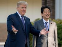 President Donald Trump  gestures as he speaks with Japan's Prime Minister Shinzo Abe last year upon his arrival for a luncheon in Japan