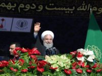 The government of Iranian President Hassan Rouhani, shown here addressing a rally in Tehran on February 11, 2018, has sought to encourage Iranians living abroad to return