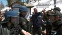Pro-migrant groups scuffled with French law enforcement officials in the alpine standoff
