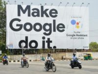 Indian commuters in Bangalore ride past an advertisement poster for Google, which is overhauling its Gmail service Indian commuters in Bangalore ride past an advertisement poster for Google, which is overhauling its Gmail service