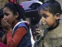 This image released early Sunday, April 8, 2018 by the Syrian Civil Defense White Helmets, shows a child receiving oxygen through respirators following an alleged poison gas attack in the rebel-held town of Douma, near Damascus, Syria. Syrian rescuers and medics said the attack on Douma killed at least 40 people. The Syrian government denied the allegations, which could not be independently verified. The alleged attack in Douma occurred Saturday night amid a resumed offensive by Syrian government forces after the collapse of a truce. (Syrian Civil Defense White Helmets via AP)