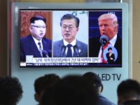 In this Wednesday, April 18, 2018, file photo, people watch a TV screen showing file footage of U.S. President Donald Trump, right, South Korean President Moon Jae-in and North Korean leader Kim Jong Un, left, during a news program at the Seoul Railway Station in Seoul, South Korea. The upcoming meeting between the leaders of the rival Koreas will be the ultimate test of Moon s belief that his nation should lead international efforts to deal with North Korea.The signs read: 