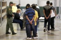 Endangering Migrant Children Hearing In this June 18, 2014, file photo, boys wait in line to make a phone call as they are joined by hundreds of mostly Central American immigrant children that are being processed and held at the U.S. Customs and Border Protection Nogales Placement Center in Nogales, Ariz. The Associated Press has learned that a Senate subcommittee has found that the government risks placing migrant children in the custody of human traffickers because federal agencies have delayed crucial reforms needed to keep the children safe. (AP Photo/Ross D. Franklin, Pool, File) catch and release