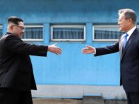 APTOPIX Koreas Summit Moon Jae in, Kim Jong Un North Korean leader Kim Jong Un, left, prepares to shake hands with South Korean President Moon Jae in over the military demarcation line at the border village of Panmunjom in Demilitarized Zone Friday, April 27, 2018. Their discussions will be expected to focus on whether the North can be persuaded to give up its nuclear bombs. (Korea Summit Press Pool via AP) Moon Jae-in, Kim Jong Un