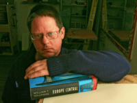 In this Nov. 23, 2005 file photo, Author William T. Vollmann poses in his studio in Sacramento, Calif., Nov. 23, 2005, with his novel "Europe Central," Nominees for the National Book Critics Circle prize were announced, Saturday, Jan. 23, 2010 and include William T. Vollmann, Hilary Mantel, Jayne Anne Phillips, Bonnie Jo Campbell, Mary Karr, and former U.S. poet laureate Louise Glueck in New York.(AP Photo/Rich Pedroncelli, File)