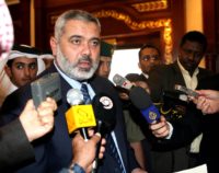 Visiting Palestinian Prime Minister Ismail Haniya talks to reporters at a press conference at Doha International Airport before his departure on Sunday, Dec 3, 2006. (AP Photo/Hamid Jalaludin)