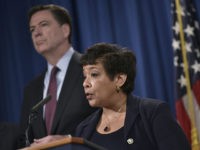 US-POLITICS-JUSTICE US Attorney General Loretta Lynch (C) speaks during a press conference at the Department of Justice on March 24, 2016 in Washington, DC. At left is FBI Director James Comey. Lynch announced the unsealing of an indictment of seven Iranians on computer hacking charges. / AFP / Mandel Ngan (Photo …