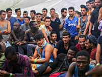 Migrants wait to reach the Italian coast on the deck of the Spanish NGO ProActiva Open Arms vessel on the Mediterranean Sea a day after being rescued off the Libyan coast, Thursday, Sept. 7, 2017. While the number of Europe-bound migrants rescued on the main Mediterranean Sea route has dropped off dramatically this summer, hundreds are still risking their lives in hopes of reaching Italy — and still being plucked to safety. (AP Photo/Bram Janssen)