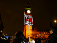 Demonstrators hold a banner during a protest against U.S President Donald Trump's controversial travel ban on refugees and people from seven mainly-Muslim countries, in London, Monday, Jan. 30, 2017. On Friday President Trump signed an executive order halting the US refugee programme for 120 days, indefinitely banning all Syrian refugees and suspended issuing visas for people from Iran, Iraq, Libya, Somalia, Sudan, Syria or Yemen for at least 90 days. (AP Photo/Alastair Grant)