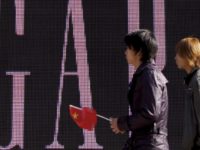 China Gap Apology In this Nov. 16, 2010 file photo, a man carries a Chinese flag as he walks past U.S. retailer GAP's newly opened flagship store in Beijing. U.S. clothing retailer Gap has apologized Monday, May 14, 2018, for selling T shirts with what it says was an "erroneous" map of China. (AP Photo/Andy Wong, File) In this Nov. 16, 2010 file photo, a man carries a Chinese flag as he walks past U.S. retailer GAP's newly-opened flagship store in Beijing. U.S. clothing retailer Gap has apologized Monday, May 14, 2018, for selling T-shirts with what it says was an "erroneous" map of China. (AP Photo/Andy …