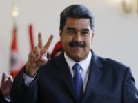 Venezuela Election Venezuela's President Nicolas Maduro makes the victory sign after a meeting with former Spanish Prime Minister Jose Luis Rodriguez Zapatero at the presidential palace in Caracas, Venezuela, Friday, May 18, 2018. Maduro is seeking a new six year mandate and, despite crippling hyperinflation and widespread shortages of food and medicine, he is widely expected to win it on May 20 in an election that opponents have denounced as a fraud and have been condemned by much of the international community. (AP Photo/Ariana Cubillos) The Latest: Venezuelans line up to vote in Sunday's election