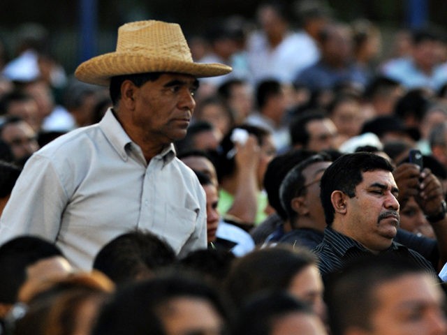 Supporters of Nicaraguan President Daniel Ortega attend a ceremony marking the start of his last year in power, at the Revolution square in Managua on January 10, 2011. AFP PHOTO/Elmer MARTINEZ (Photo credit should read ELMER MARTINEZ/AFP/Getty Images)