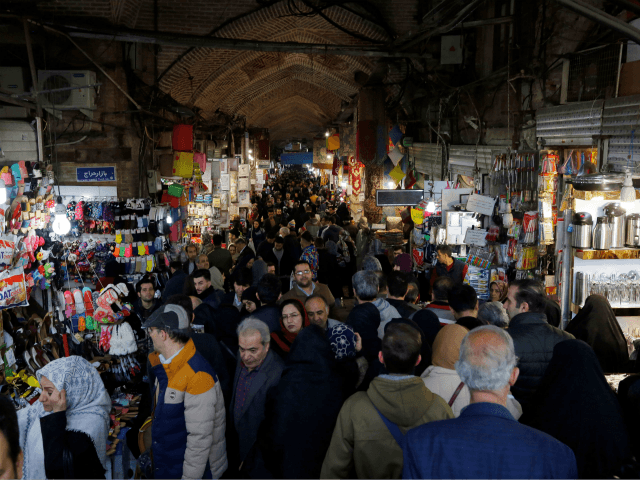 Iranians shop at Tehran's ancient Grand Bazaar on January 4, 2018. / AFP PHOTO / ATTA KENARE (Photo credit should read ATTA KENARE/AFP/Getty Images)
