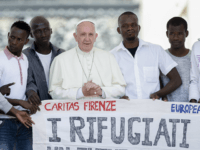 Pope Francis poses for a photo with a group of refugees he invited to join him on the steps of St. Peter's Basilica during his weekly general audience in St. Peter's Square at the Vatican, Wednesday, June 22, 2016. Pope Francis has invited a dozen refugees to join him on …