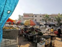 A picture taken on June 6, 2018, shows people shopping at a market in the northern Syrian town of Manbij A picture taken on June 6, 2018, shows people shopping at a market in the northern Syrian town of Manbij