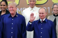 US President Donald Trump (L) and Russia's President Vladimir Putin (R) posing for a group photo ahead of the Asia-Pacific Economic Cooperation (APEC) Summit leaders' gala dinner in Danang, Vietnam, in November 2017