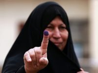 Iraq Elections In this May 12, 2018 file photo, an Iraqi woman shows her ink stained finger after casting her vote in the country's parliamentary elections in Ramadi, Iraq. Iraq’s parliament voted on Wednesday, June 6, 2018, in favor of a manual ballot recount after allegations of widespread fraud in the country's recently held parliamentary elections, a lawmaker said, a development that could further prolong the process of forming a new government. (AP Photo/Hadi Mizban, File) In this May 12, 2018 file photo, an Iraqi woman shows her ink-stained finger after casting her vote in the country's parliamentary elections in Ramadi, Iraq. Iraq’s parliament voted on Wednesday, June 6, 2018, in favor of a manual ballot recount after allegations of widespread fraud in the country's recently …