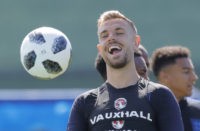 The Latest: England players won over by Argentine tea