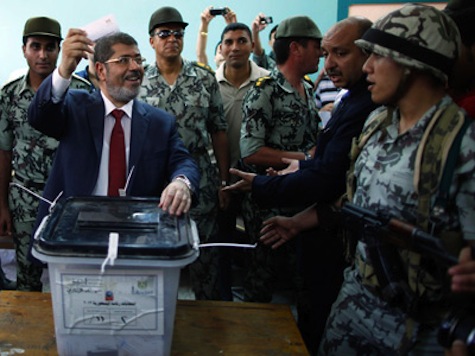Egypt's Morsi Promises Democracy, Protests Rage