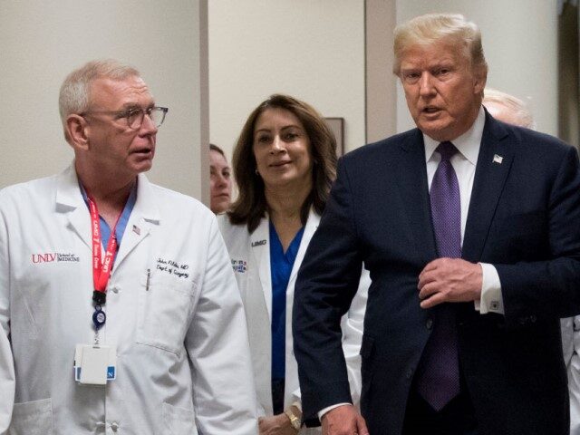 GettyImages-857601746 Surgeon Dr. John Fildes walks with President Donald Trump at University Medical Center, Oc