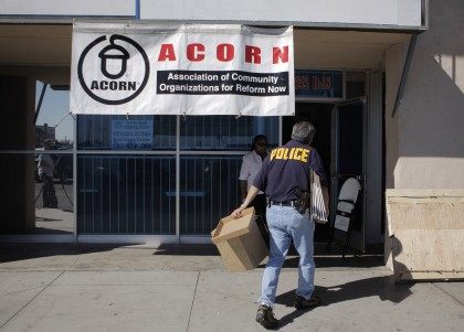 An investigator enters the ACORN office in Las Vegas, Tuesday, Oct. 7, 2008. A Nevada secretary of state's office spokesman said Tuesday that investigators are looking for evidence of voter fraud at the office.(AP Photo/Jae C. Hong)