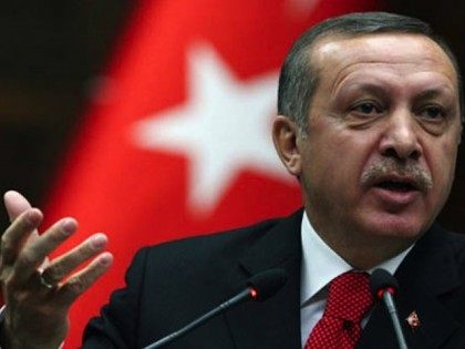 Turkish Prime Minister Recep Tayyip Erdogan addresses lawmakers at the parliament in Ankara, Turkey, Tuesday, March 22, 2011. Erdogan said that he has concerns about possible NATO military action in Libya, but he has not flatly opposed such a mission. "Turkey will not point arms at the Libyan people," he …