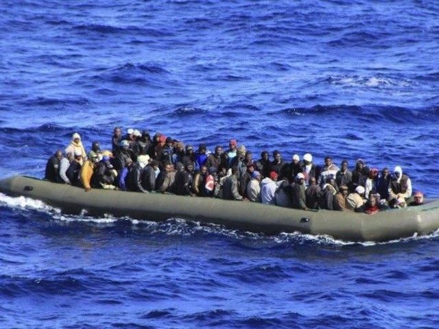 Migrants being approached by Italian navy in Mediterranean