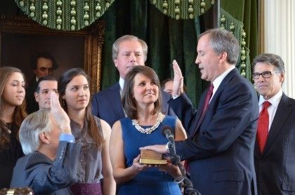 Texas Attorney General Ken Paxton takes the oath of office from outgoing AG Greg Abbott.
