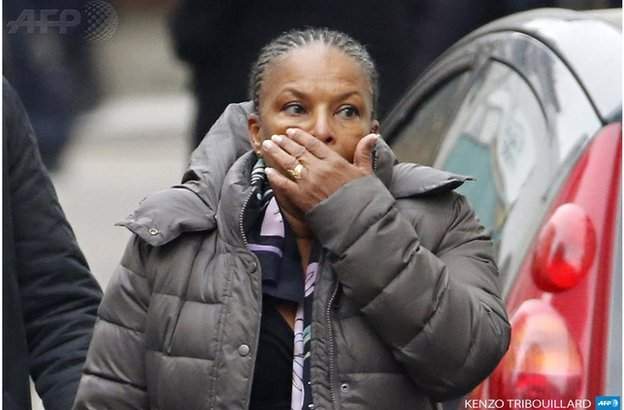 A woman is shocked by news of the killings. Credit: AFP