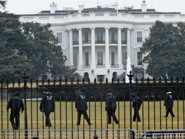 Secret Service officers search the south grounds of the White House in Washington, Monday,