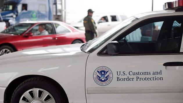 A U.S. Customs and Border Patrol agent keeps watch at a checkpoint station