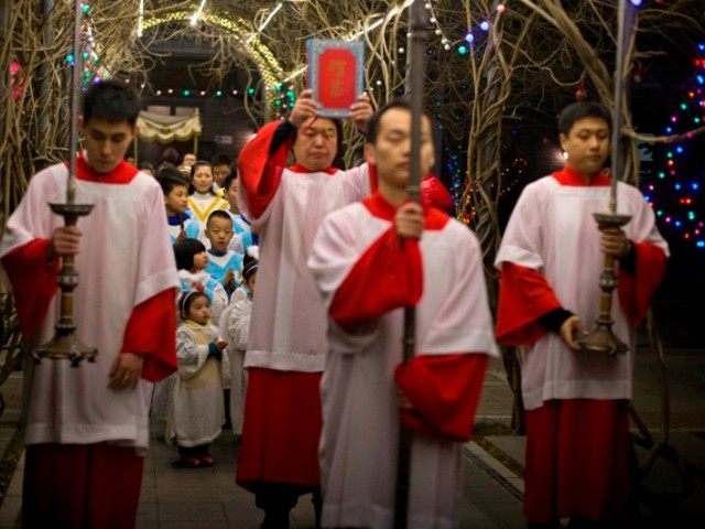 Children prepare to take part in a mass on the eve of Christmas at the South Cathedral official Catholic church in Beijing, China, Wednesday, Dec. 24, 2014. Estimates for the number of Christians in China range from the conservative official figure of 23 million to as many as 100 million …