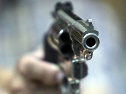 An employee at John Jovino Co. holds a revolver on Thursday, June 26, 2008 in New York. The U.S. Supreme Court ruled earlier in the day that Americans have a constitutional right to keep guns in their homes for self-defense - the justices' first major pronouncement on gun control in …