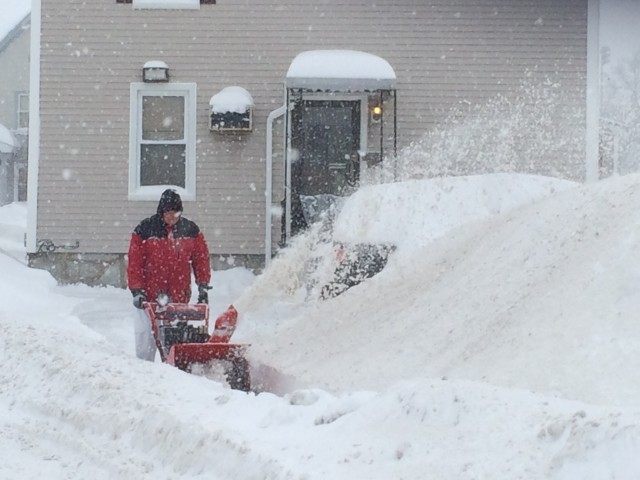 Guy Snow Blowing