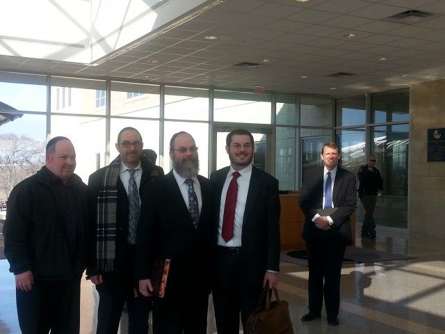 Rabbi Rich with Liberty atty Butterfield in bg is Liberty atty Matteer