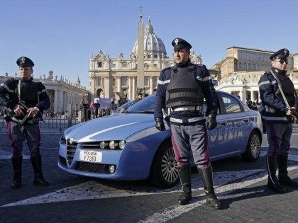 Italian policemen patrol in front of Saint Peter's Square in Rome