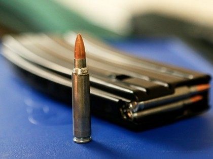 UNITED STATES, Salt Lake City : SALT LAKE CITY, UT - JANUARY 15: Ammo and a high capacity 30 round clip sits on the table at the "Get Some Guns & Ammo" shooting range on January 15, 2013 in Salt Lake City, Utah. Lawmakers are calling for tougher gun legislation …
