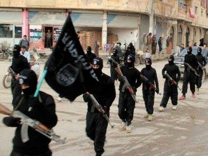 This undated file image posted on a militant website on Tuesday, Jan. 14, 2014 shows fighters from the al-Qaida-linked Islamic State of Iraq and the Levant (ISIL) marching in Raqqa, Syria. Saudi Arabia and other Gulf petro-powerhouses encouraged a flow of cash to Sunni rebels in Syria for years. But …