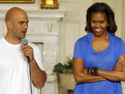 First lady Michelle Obama stands with White House Senior Policy Adviser for Nutrition Policy Sam Kass. The food czar was snubbed from speaking at the School Nutrition Association's convention in Boston.